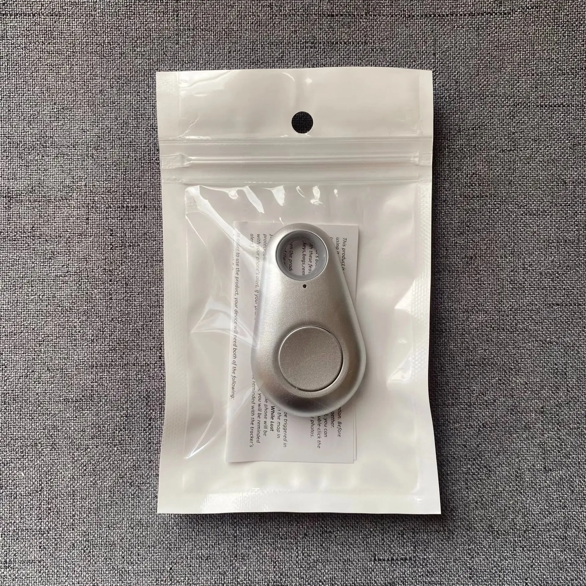 Mini Bluetooth GPS Tracker for Pets, Kids, Bags, and Wallets.